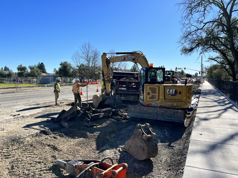 Excavator trenching for a new fire hydrant installation