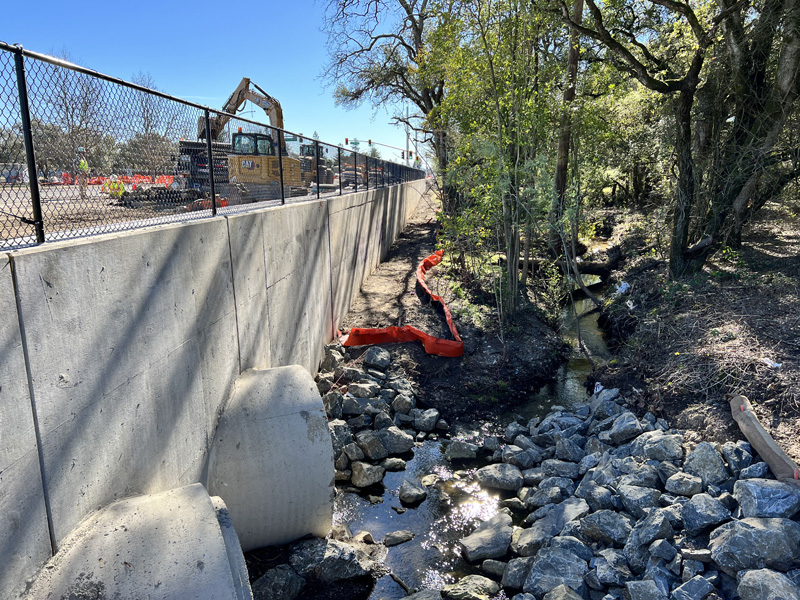 New 72" concrete storm drain culvert outfalls flowing into Peterson Creek