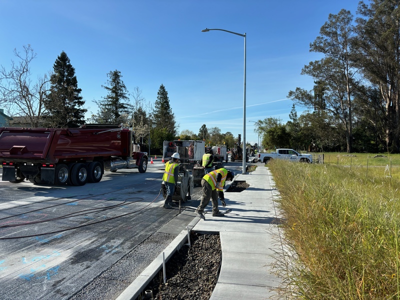 Saw-cutting portions of the road in preparation for removal