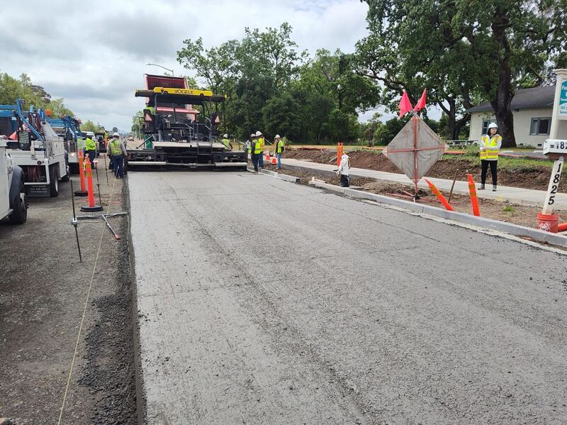 A newly installed strip of concrete road surface installed utilizing the RCC paving equipment