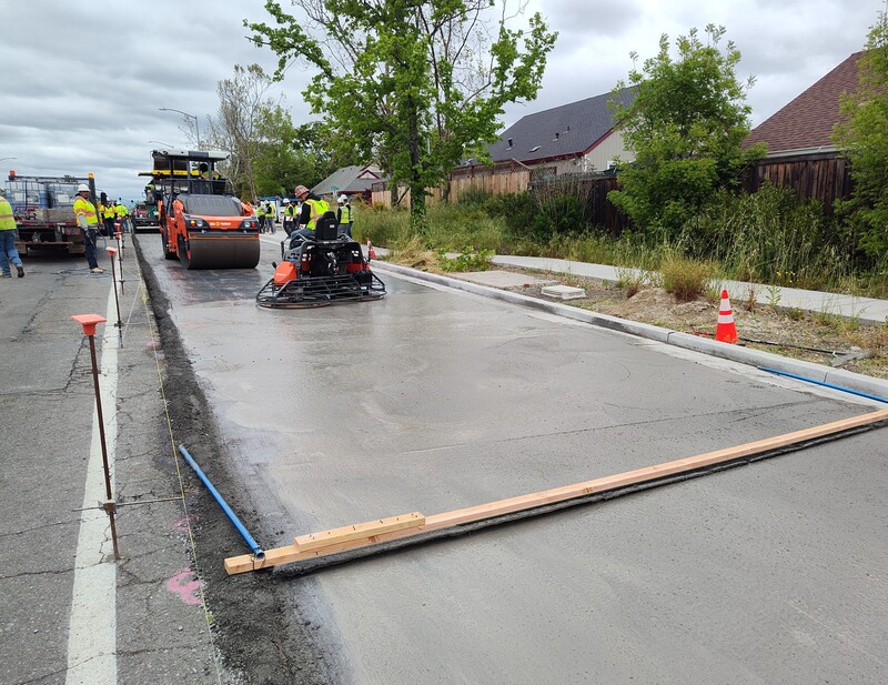 Finishing the surface on the newly installed RCC pavement