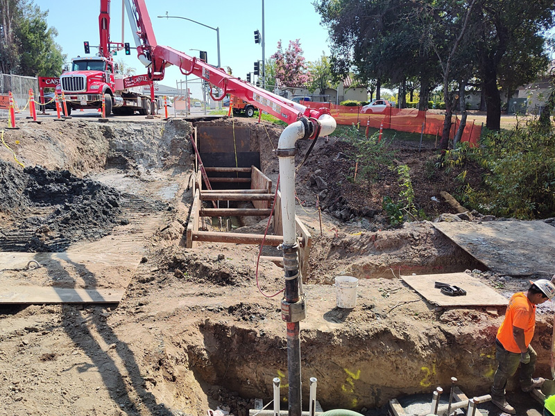 Pouring concrete piles that will support a new retaining wall