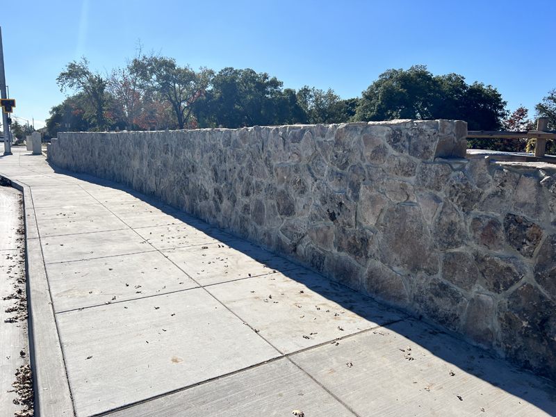 New stone veneer on the retaining wall near Community Youth Park