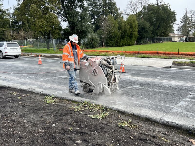 Crews performing saw-cutting along the inner lanes of Fulton Road