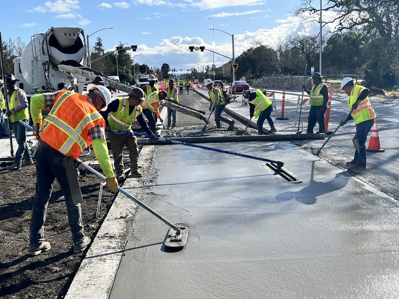 Crews pouring and finishing the new concrete