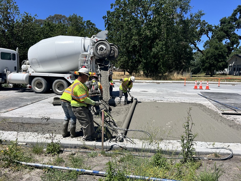 Pouring new concrete for a recently removed section of road